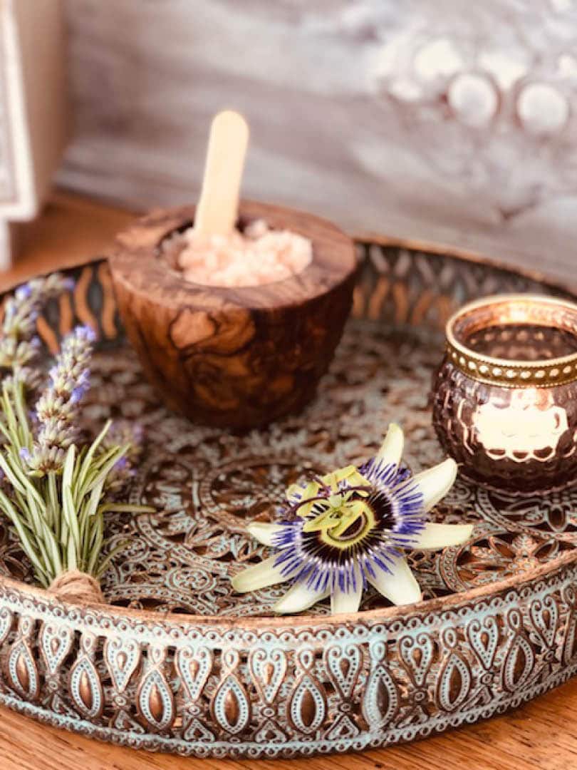 A close-up of lavender, flowers and salts.